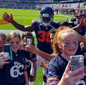 Grove, Holmes students play flag football at Soldier Field